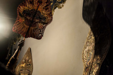 Dalang (puppet master) Dwi Puspita skillfully wields a character in a wayang kulit (shadow puppet) performance. The term wayang is Javanese and means &ldquo;shadow&rdquo; or &ldquo;imagination.&rdquo; JP/Irene Barlian
