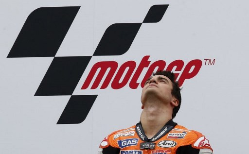 Dani Pedrosa pictured in front of MotoGP logo in this Nov. 11, 2012 file photo. The coronavirus outbrealk has already cast a long shadow over the start of the MotoGP season with this Sunday's curtain raising Qatar Grand Prix called off, followed by the March 22 race in Thailand.