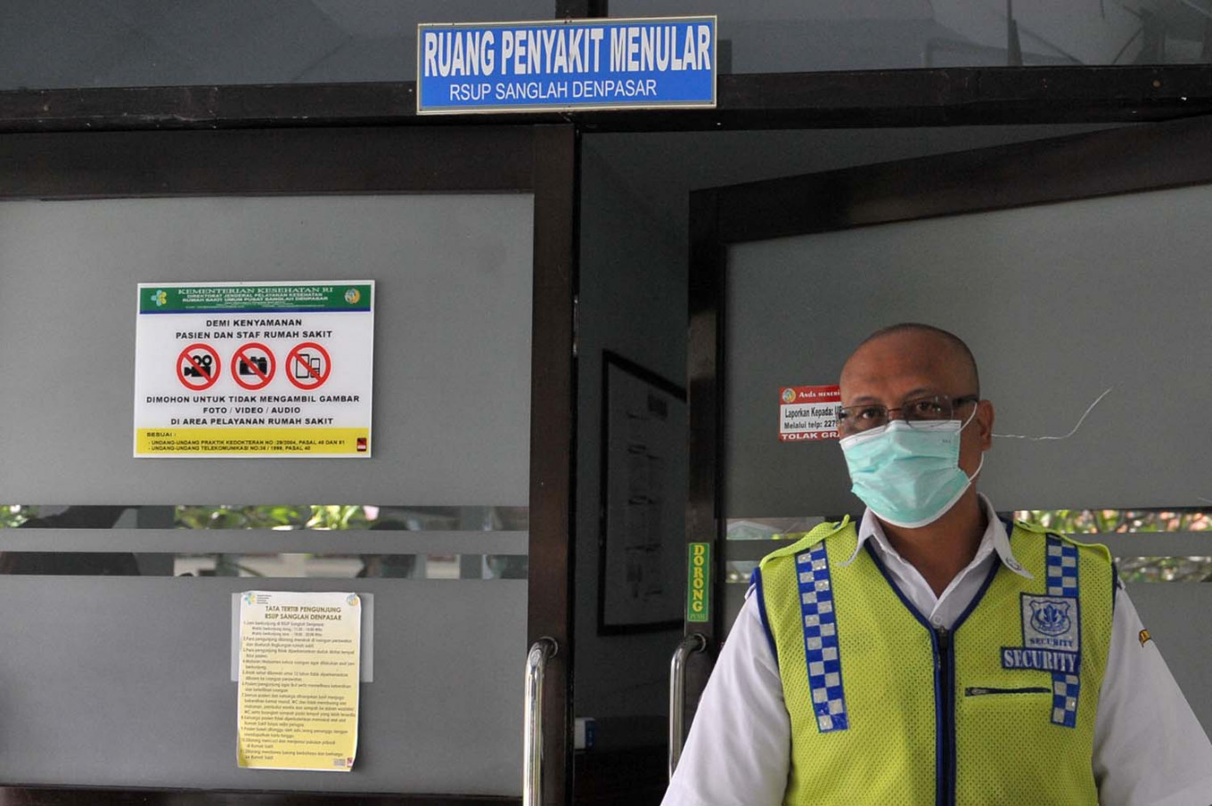 A security guard stands in front of an isolation ward at Sanglah General Hospital in Denpasar, Bali, on March 3.