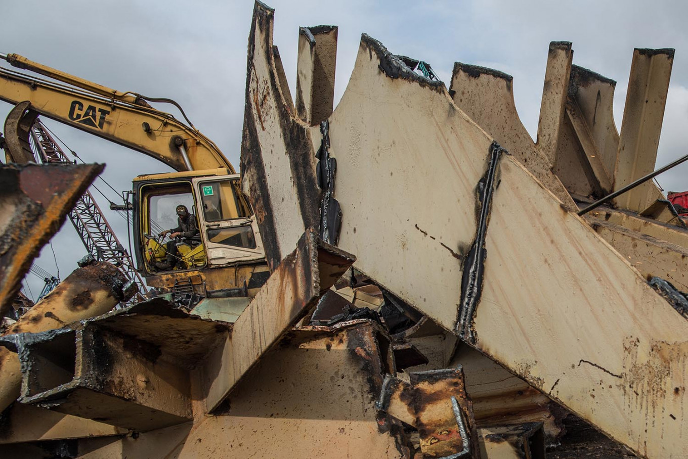 Marine mound: A worker moves the ruins of a dismantled ship using heavy equipment.. JP/Afriadi Hikmal