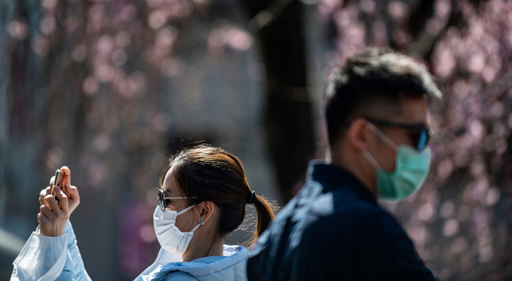 Japan warns against cherry blossom parties over coronavirus