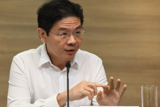 Singapore to hold off on further reopening measures: minister