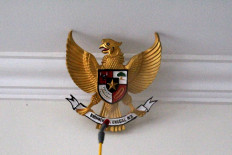 Indonesia’s national emblem, the Garuda Pancasila, is sprayed with disinfectant liquid. JP/Fauzan