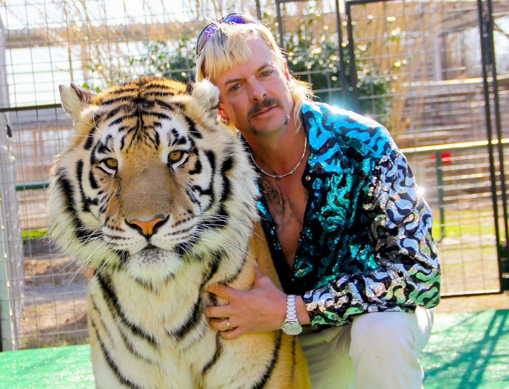 This undated photo courtesy of Netflix shows Joseph 'Joe Exotic' Maldonado-Passage with one of his tigers. 