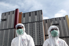 Indonesian Red Cross staff prepare to sterilize Wisma Atlet Kemayoran in Jakarta on March 21. 2020 prior to the opening of the COVID-19 hospital there. JP/Seto Wardhana