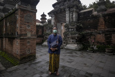 Albertus Vlara Siswantoro, 25, maintains his regular visits to the Mataram kings funeral complex. Before the coronavirus pandemic, the site welcomed hundreds of visitors every day. JP/ Arnold Simanjuntak
