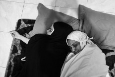 Being at home allows Hayatul to spend more time with her mother. JP/Raudhatul Jumala