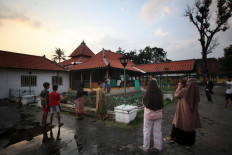 . Many people take part in the padusan ritual despite warnings to restrict public gatherings amid the COVID-19 outbreak. JP/Boy T Harjanto