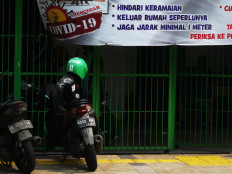This Grab Kitchen merchant in Petamburan, West Jakarta, is still taking orders during the large-scale social restrictions (PSBB) period in Jakarta. Grab Kitchen is part of the multi-service platform Grab.  JP/Sutrisno Jambul