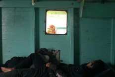 A passenger sleeps in the cabin. The travel time between one to another island within Wakatobi ranges between two to six hours. JP/Edy Susanto