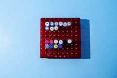 The reagents, as seen in the tubes, are necessary to isolate the indicators for the coronavirus ribonucleic acid (RNA) from human DNA in swab samples to determine whether the test subject has the virus or not. JP/Agung Parameswara