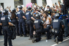 A man screams with emotion as he sees a policeman take a knee while hundreds protest the death of George Floyd next to the White House on May 31, 2020 in Washington, DC. -Thousands of National Guard troops patrolled major US cities after five consecutive nights of protests over racism and police brutality that boiled over into arson and looting, sending shock waves through the country. The death Monday of an unarmed black man, George Floyd, at the hands of police in Minneapolis ignited this latest wave of outrage in the US over law enforcement's repeated use of lethal force against African Americans -- this one like others before captured on cellphone video. AFP/Roberto Schmidt