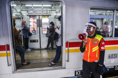 Commuters return to public transport with more protective gear