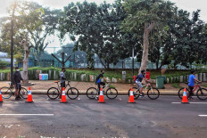 Cyclists line up to enter the Senayan sports complex in Jakarta on June 6. JP/Seto Wardhana