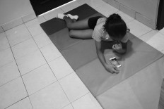 Ave video calls with a friend in between training sessions.  JP/Toto Santiko Budi