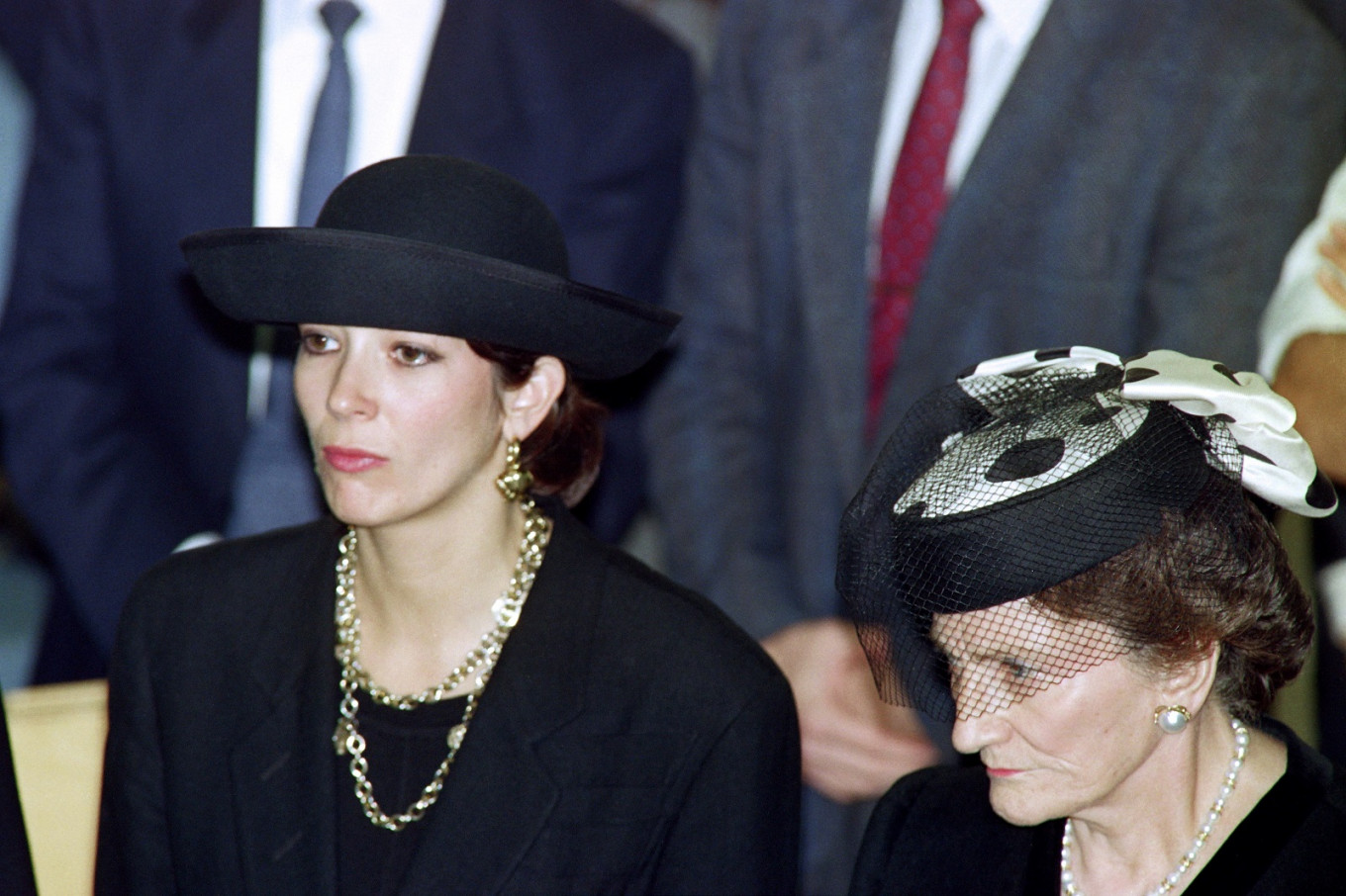 In this file photo taken on November 10, 1991 British press magnat Robert Maxwell's daughter Ghislaine (L) and wife Elisabeth (R) attend the funeral serice for burial on the Mount of Olives of their father and husband. British socialite Ghislaine Maxwell carries the heavy heritage of a family dominated by the unusual personality of her father, Robert, drowned at sea in mysterious circumstances leaving behind a resounding financial scandal and the fall of his press empire.
