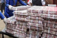 The Attorney General’s Office confiscated Rp 97 billion (US$6.7 million) in cash and oil refining infrastructure from Honggo Wendratno, who was found guilty of causing state losses of Rp 37.8 trillion in a corruption case. Honggo is still at large. JP/Seto Wardhana