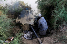 Ahmed Mohamed, a mechanic and farmer, fixes a water pump machine near the banks of the Blue Nile River on Tuti Island, Khartoum, Sudan, February 20, 2020. Reuters/Zohra Bensemra