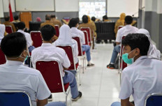 Students of SMA 1 state senior high school in Bogor, West Java, attend the school’s orientation program on the first day of school on July 13. To prevent the virus from spreading, learning activities for schools in Bogor are still being held virtually. - JP/P.J.Leo
