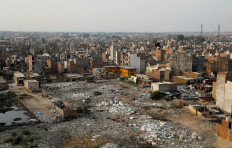 Rubbish bags stand at a landfill site, near a residential area, during the coronavirus disease (COVID-19) outbreak, in New Delhi, India, July 9, 2020. Reuters/Adnan Abidi 