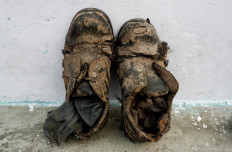 Shoes belonging to Mansoor Khan, a waste collector, are left outside of his home, next to a landfill site, during the coronavirus disease (COVID-19) outbreak, in New Delhi, India, July 16, 2020. Reuters/Adnan Abidi 