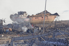 The wreckage of a ship is seen following yesterday's blast at the port of Lebanon's capital Beirut, on August 5, 2020. - Rescuers worked through the night after two enormous explosions ripped through Beirut's port, killing at least 78 people and injuring thousands, as they wrecked buildings across the Lebanese capital. 