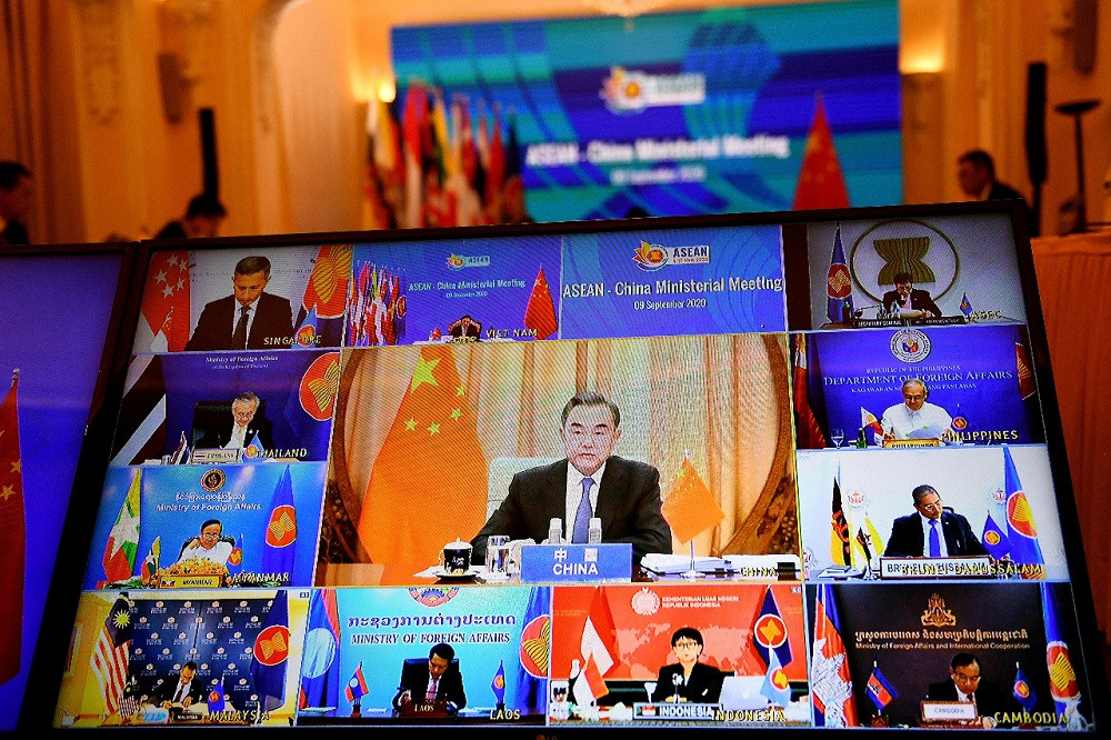 China's Foreign Minister Wang Yi (center on screen) addresses counterparts from ASEAN countries in a live video conference during the ASEAN-China Ministerial Meeting held online due to the COVID-19 on Sept. 9, 2021.