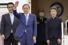 Suga opposes China's maritime actions in talks with Vietnam leader