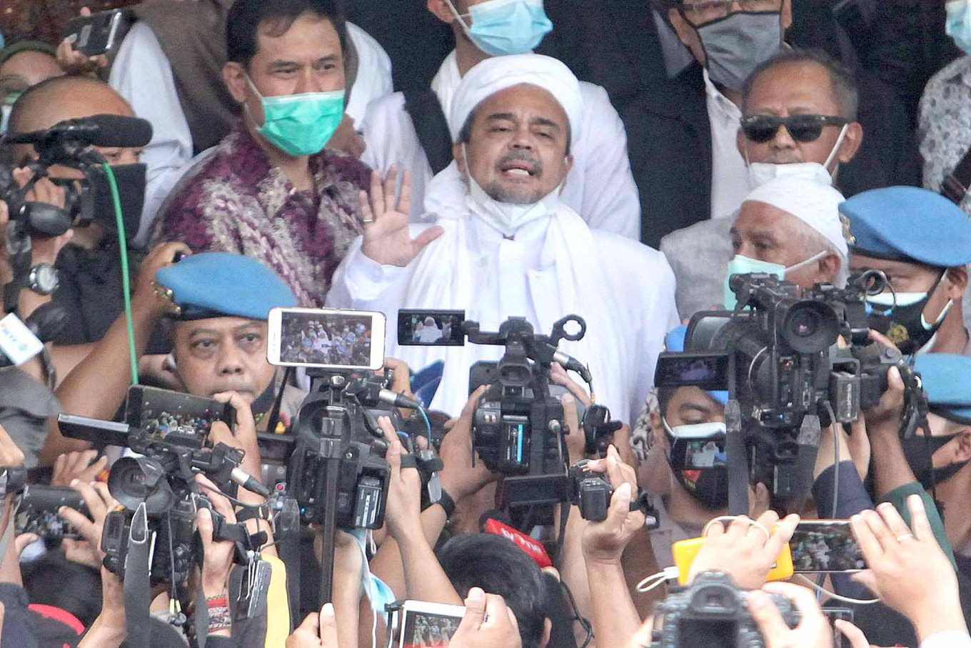 Rizieq Shihab arrives at the Jakarta Metro Police headquarters in Jakarta on Dec 12, 2020. 