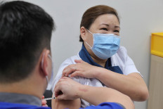 Singapore prepares for long term life - and death - with COVID-19
