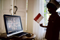 Virtual celebration: Five-year-old Rashan participates in an online commemoration of Indonesia’s Independence Day held by the Al Azhar Kindergarten in Jakarta on Aug.17. The commemoration was held online as school buildings across the country were shut in response to the coronavirus. JP/Seto Wardhana