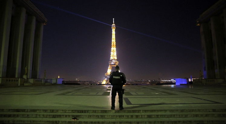 World ushers in 2021 with muted celebrations