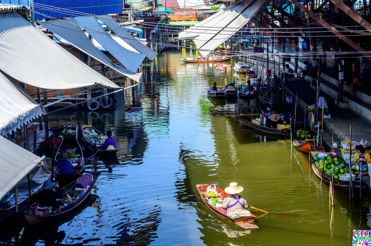 This photograph taken on December 8, 2020 shows a vendor steering her boat while looking for customers at the Damnoen Saduak floating market, nearly deserted with few tourists due to ongoing COVID-19 travel restrictions, some 100km southwest of Bangkok.
